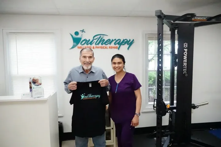 A patient working one-on-one with a staff member at Youtherapy Wellness and Physical Rehab in Milford
